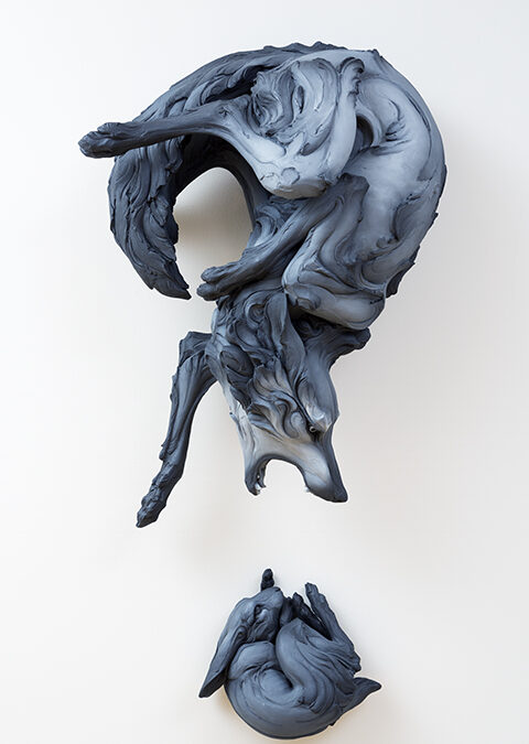 Wolf and rabbit sculpture by artist Beth Cavener