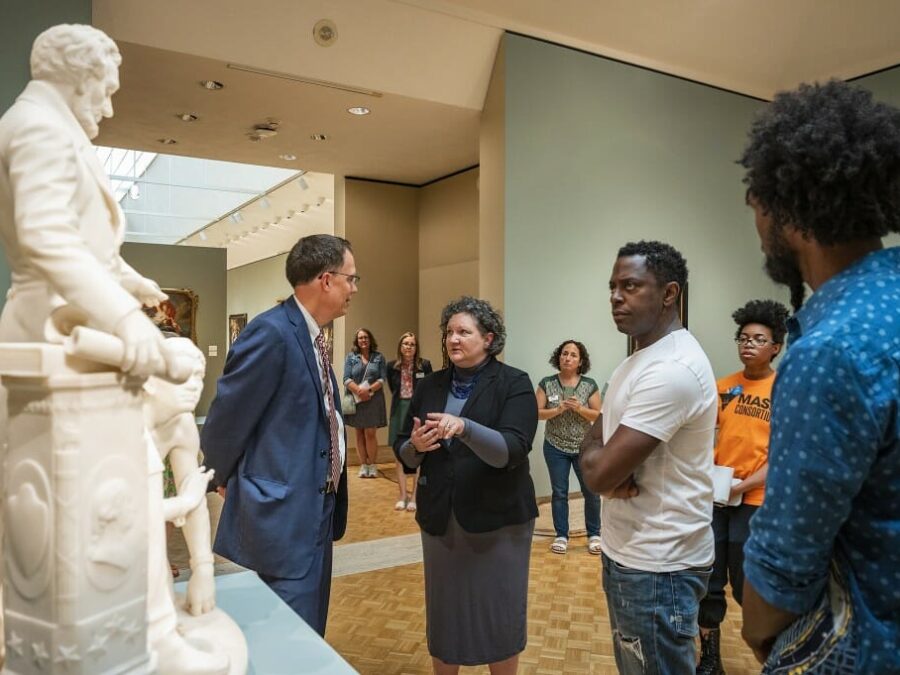 Artist Sanford Biggers (right), joined by Provost John Karl Scholz (left) and museum director Ay Gilman (center), visited the Chazen to plan for an upcoming exhibition that will respond to the 1873 Thomas Ball sculpture. Photo: Bryce Richter
