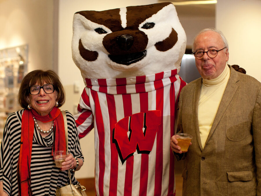 Johanna (l) and Leslie (r) Garfield are seen with Bucky Badger at the Fifth Birthday Party for the Chazen Building