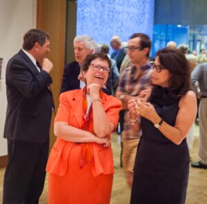 Rebecca Blank, center, talks with Pamela Hootkin, right, and the opening reception for "The Human Condition: The Stephen and Pamela Hootkin Collection" fall semester, 2014