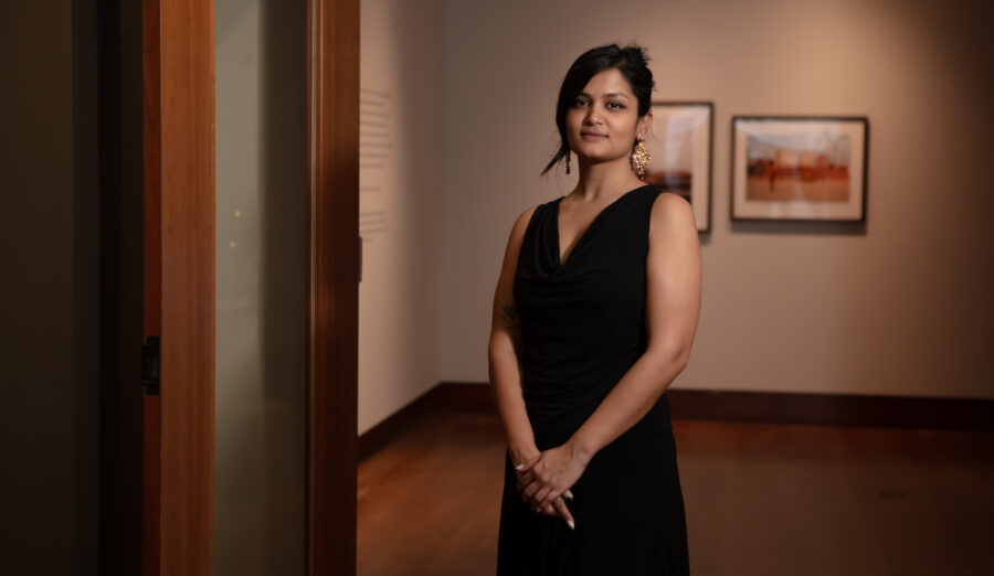 Anamika Siingh standing at the entrance to the exhibition.