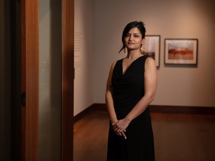 Anamika Siingh standing at the entrance to the exhibition.